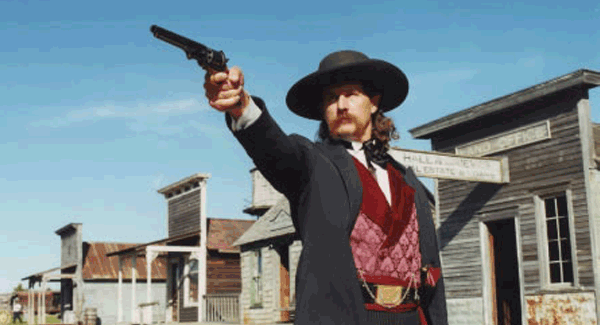 Cowboy holding a six shooter
